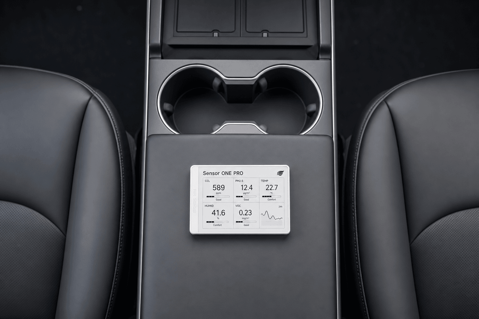 Air Sensei Sensor ONE PRO resting on a Tesla Model Y center console